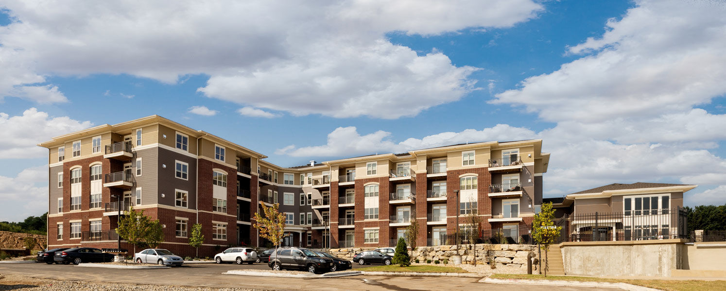 Large brick and siding apartment buildings